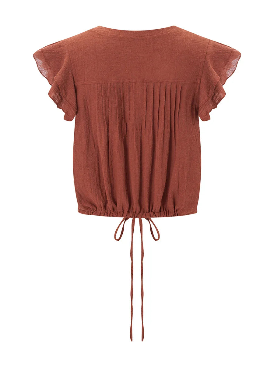 Women's crop top in cotton gauze with ruffle front — beach