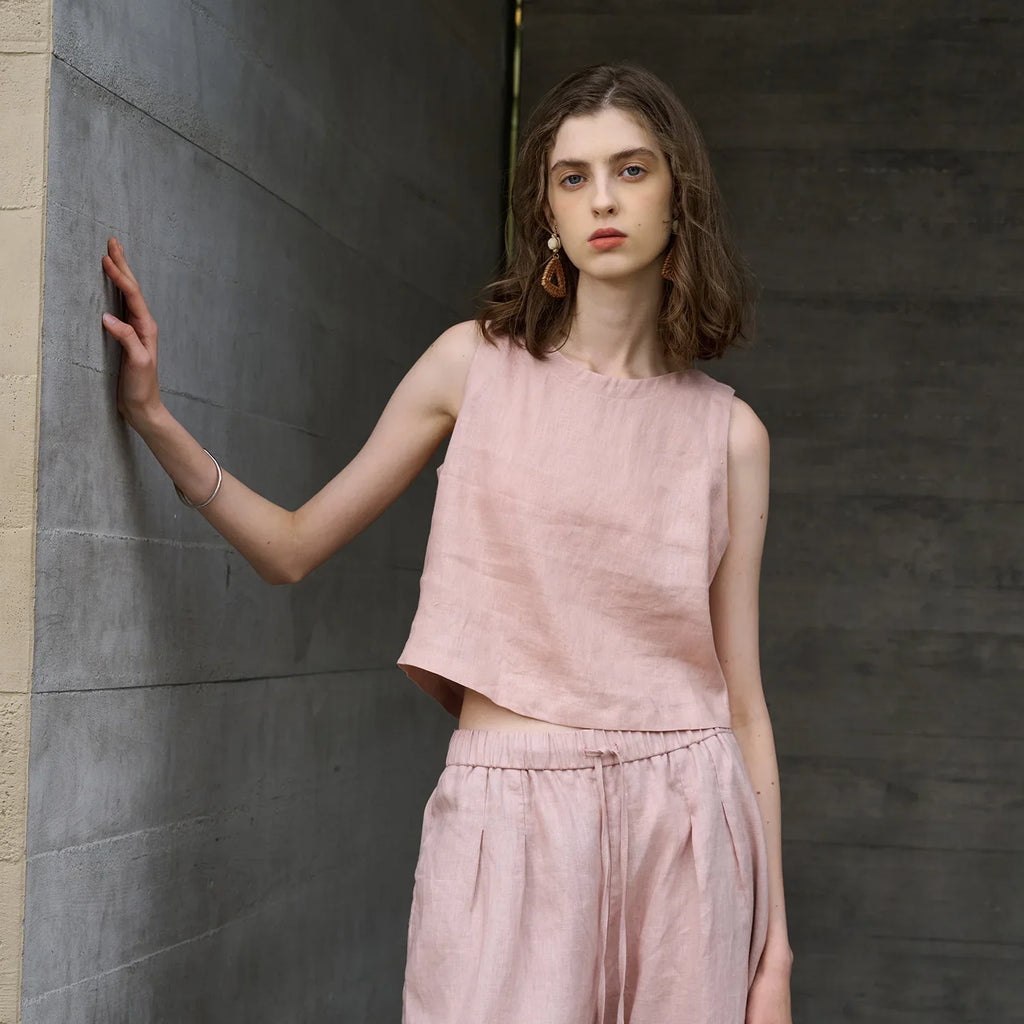 Asymmetric linen crop top for women featuring sleeveless crew neck