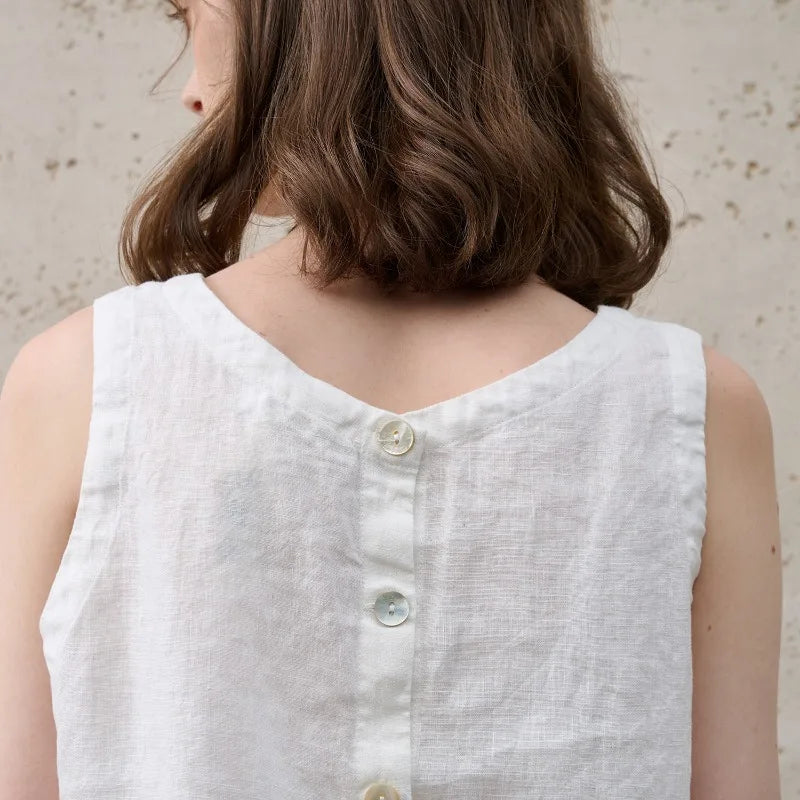 Asymmetric linen crop top for women featuring sleeveless crew neck