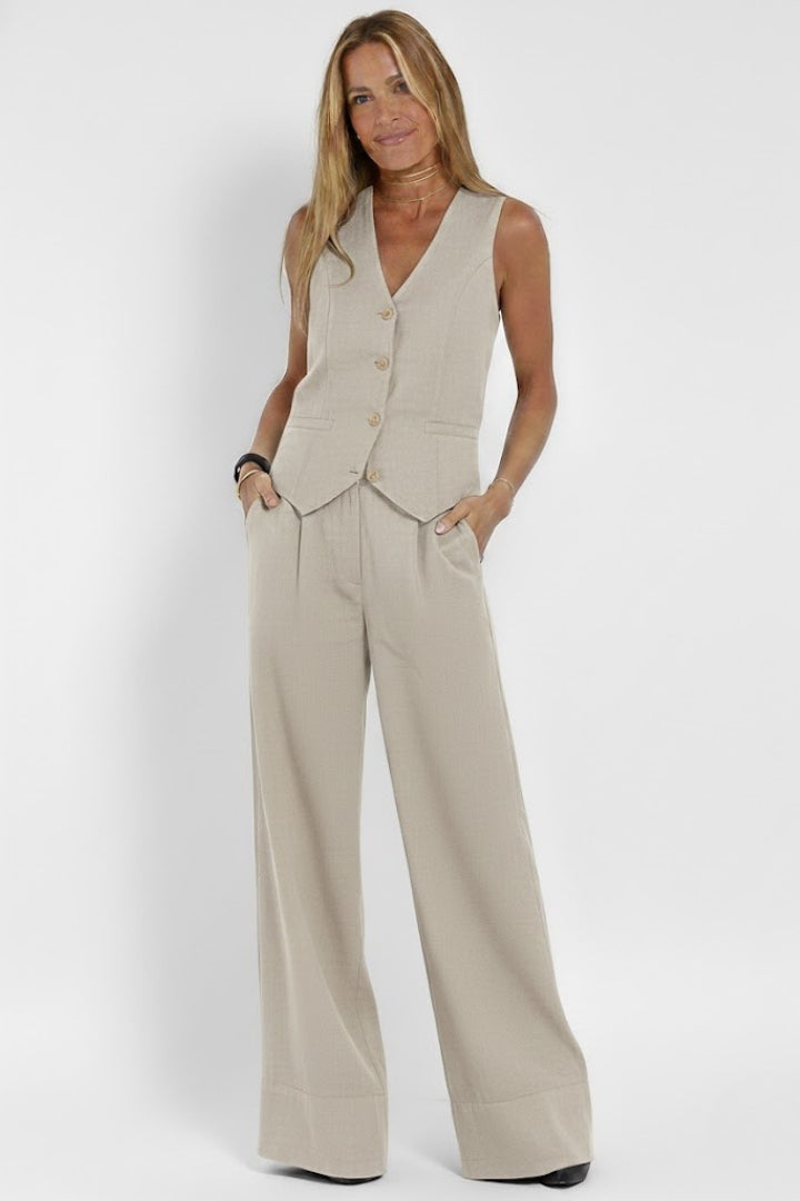 Women's outfit - formal sleeveless vest and wide high-waisted pants | interview