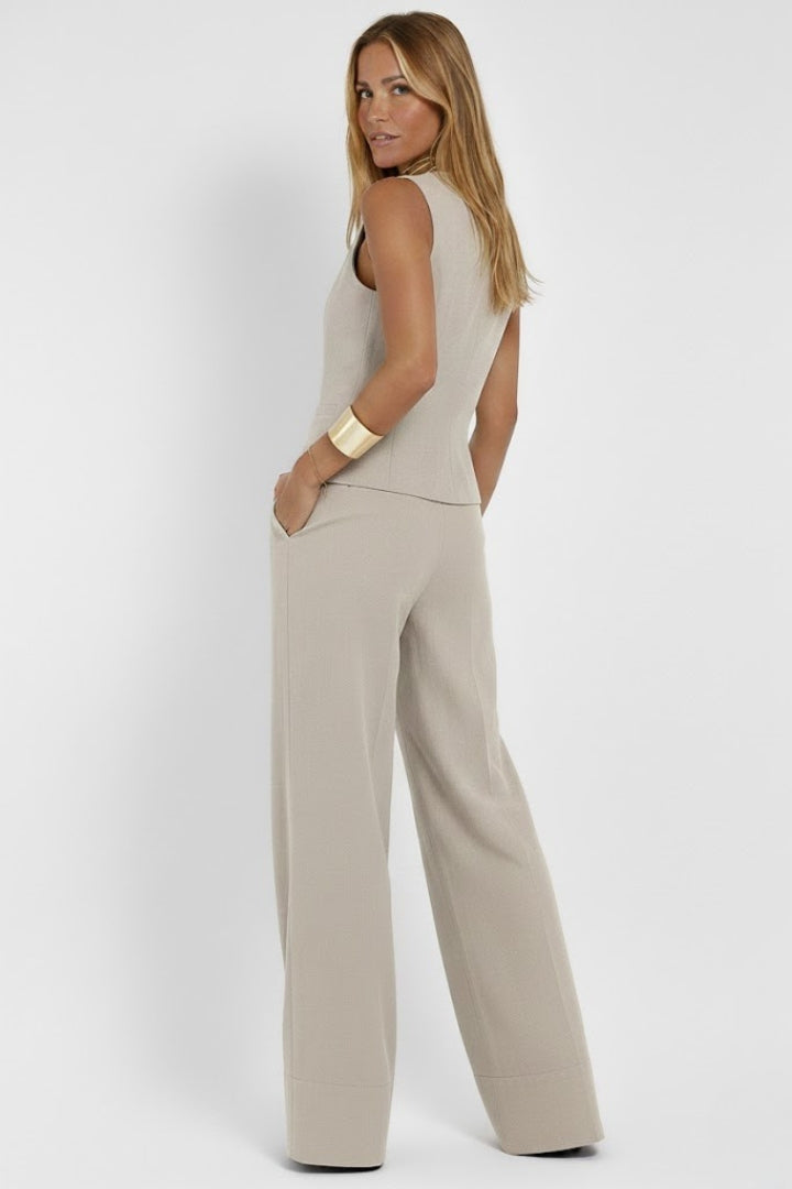 Women's outfit - formal sleeveless vest and wide high-waisted pants | interview